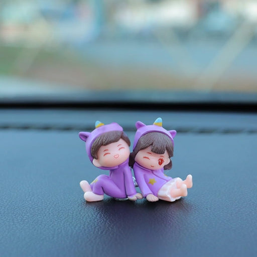 1 Set (2 Pcs) Adorable Couple Miniature Figurines in Purple Unicorn Outfits | Cute Boy & Girl Sitting Pose Showpiece for Car Dashboard, Home Decor, Gifting, Birthday & Anniversary