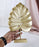 1 Pc Monstera Leaf Shape Golden MDF Partical Board Showpiece for Home Decor, Office Desk,Living Room, Bedroom, Dining Room, Rakshabandhan Gifting, Centerpiece, Table Decor(Pack of 1) (Model 2)