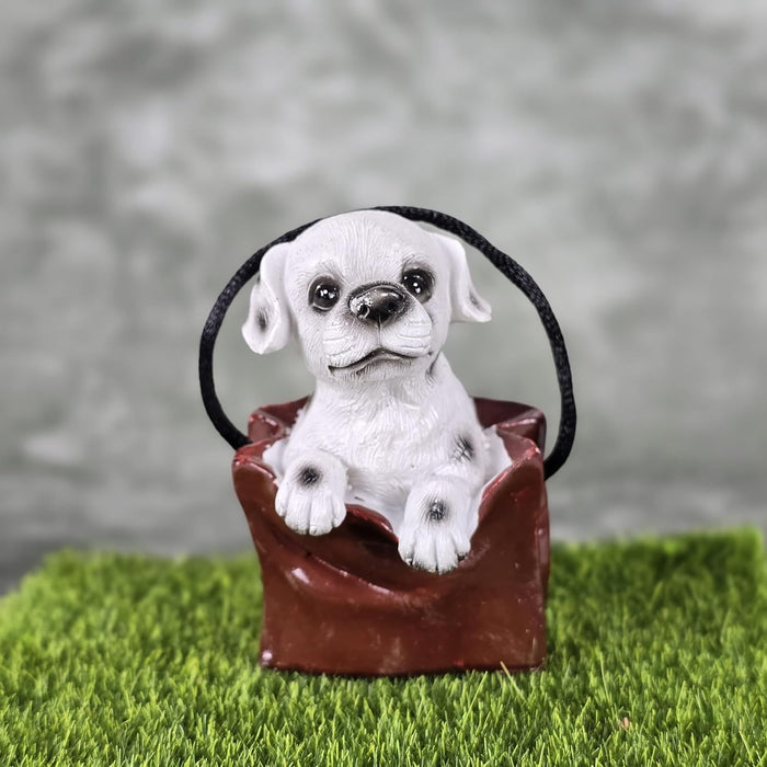 1 pc Cute Miniature Dog in Bag Poly Resin Statue with Hanging, Decorative Piece for Living Room, Bed Room, Table top, Restaurant, cafes, Gifting, Birthday( Pack of 1)